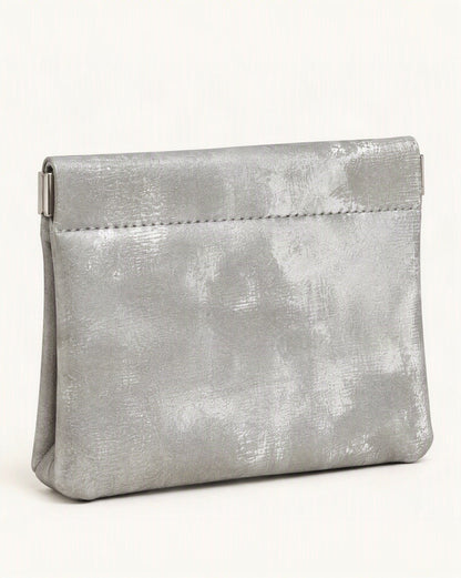 Satin Cowhide Mini Card Pouch with Spring Clasp Closure — front three-quarter view on a warm white background