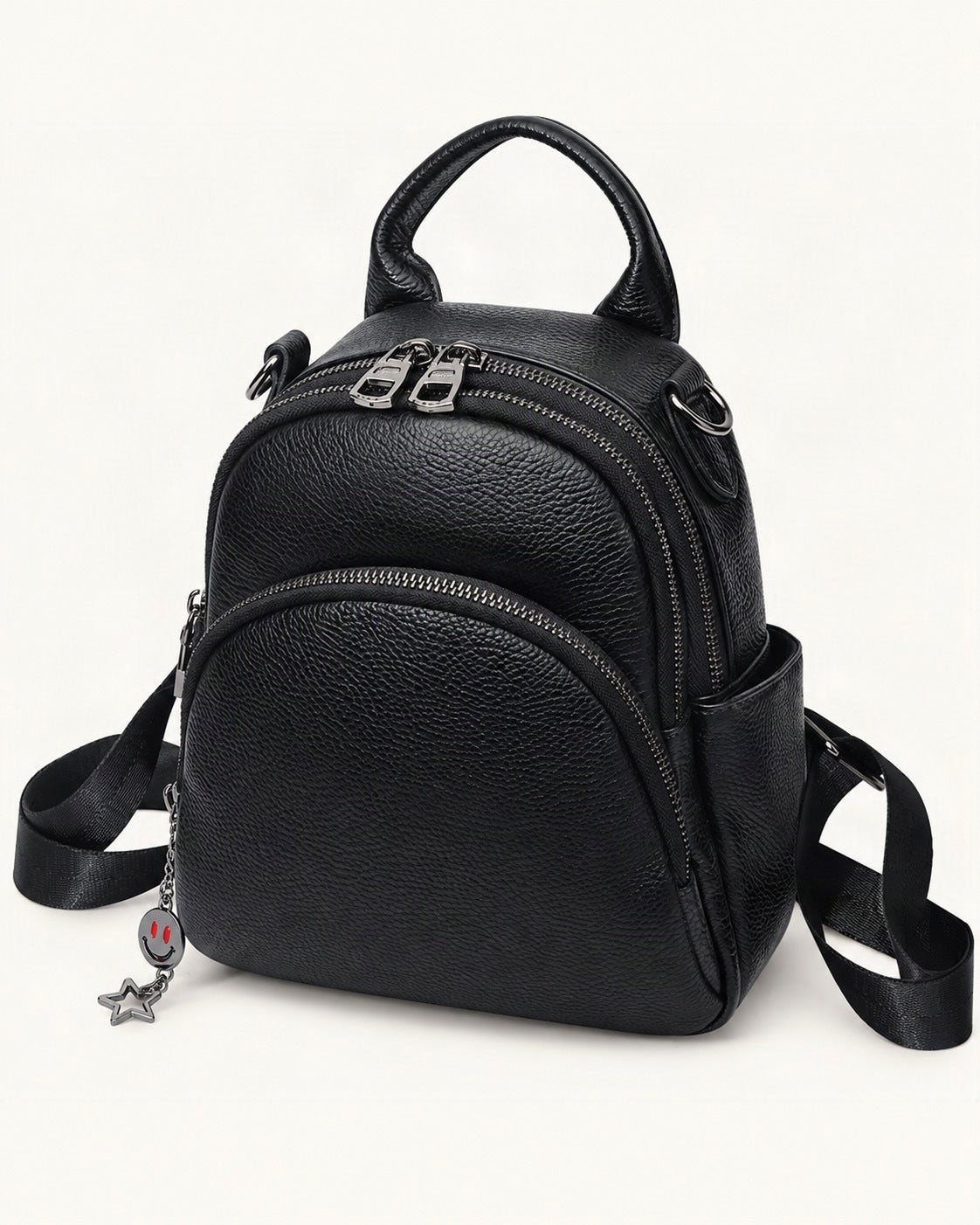 Top-Grain Cowhide Convertible Backpack — front three-quarter view on a warm white background