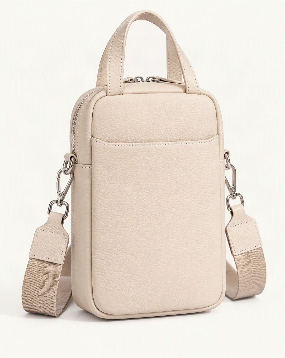 Pebbled Cowhide Leather Mini Crossbody Phone Bag — front three-quarter view on a warm white background