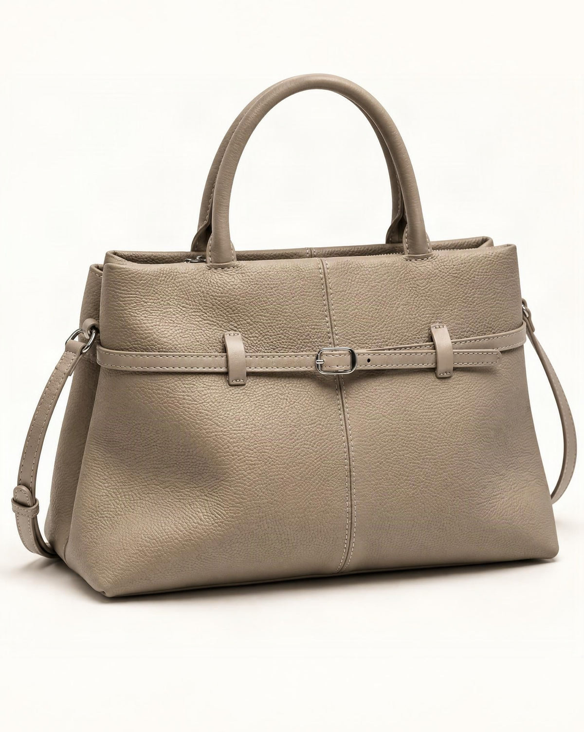 Cowhide Leather Small Tote Bag with Adjustable Strap — front three-quarter view on a warm white background