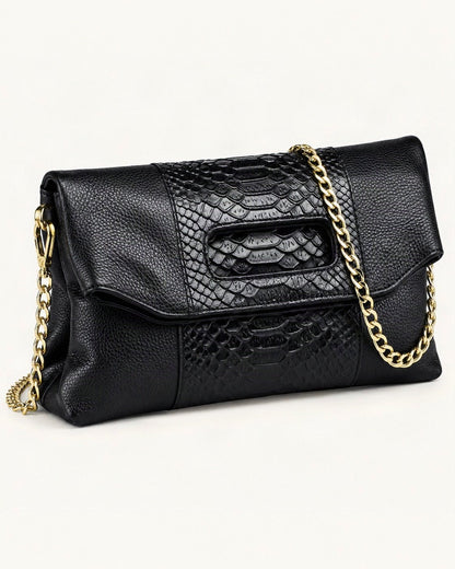 Top-Grain Cowhide Envelope Clutch — front three-quarter view on a warm white background