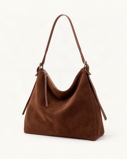 Suede Cowhide Small Plus Shoulder Tote Bag — front three-quarter view on a warm white background