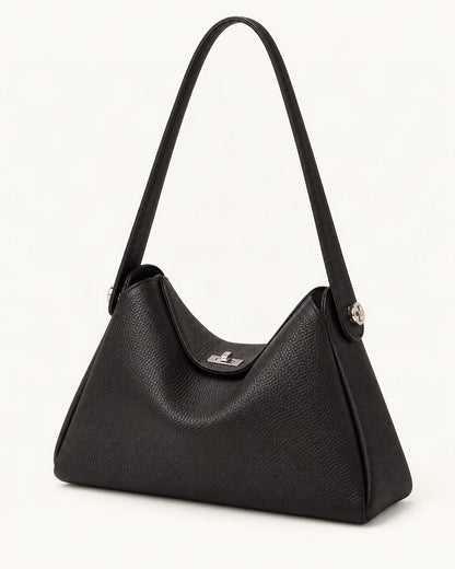 Pebbled Cowhide Leather Underarm Crossbody Bag — front three-quarter view on a warm white background