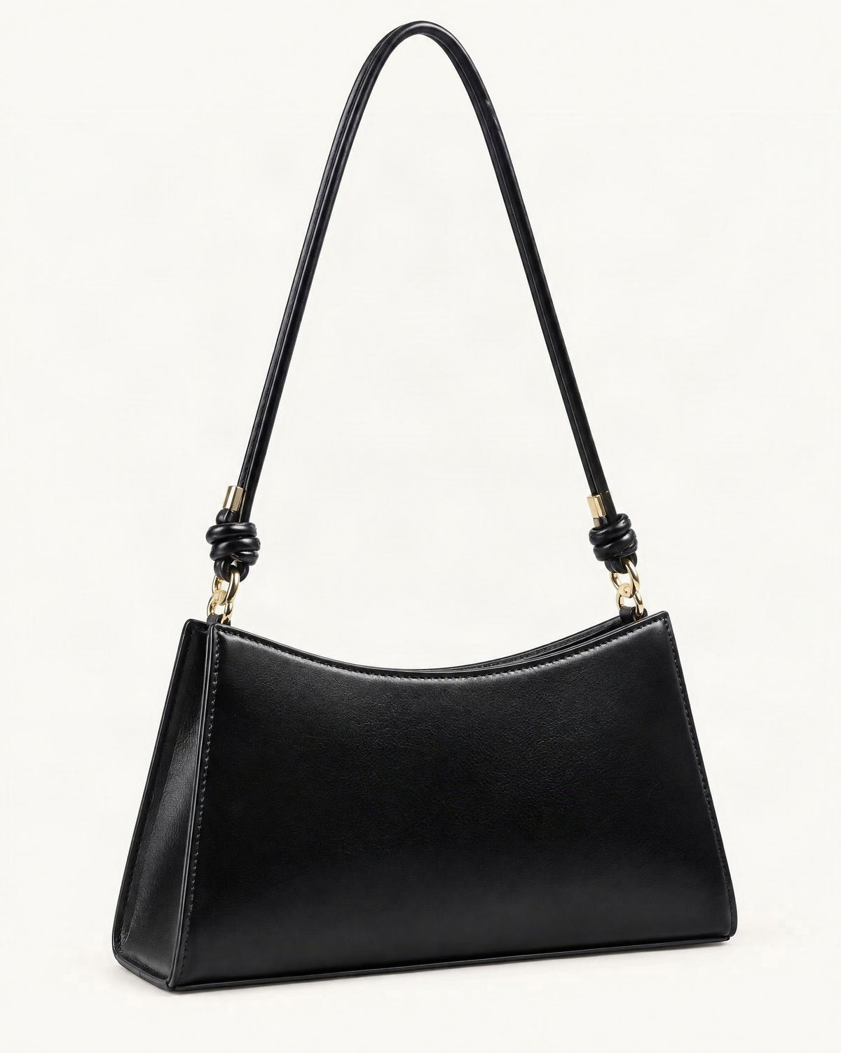 Cowhide Leather Underarm Shoulder Bag with Knotted Strap — front three-quarter view on a warm white background