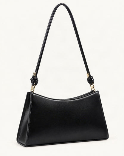 Cowhide Leather Underarm Shoulder Bag with Knotted Strap — front three-quarter view on a warm white background