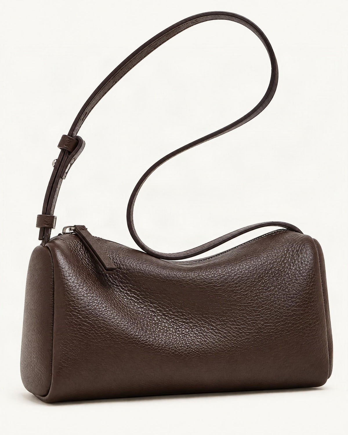 Cowhide Leather Small Barrel Crossbody Bag — front three-quarter view on a warm white background