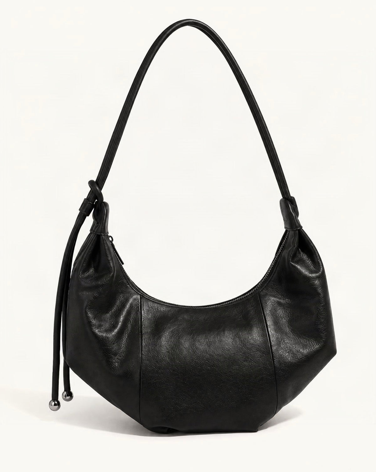 Top-Grain Cowhide Crescent Hobo Bag, Soft Crescent Crossbody — front three-quarter view on a warm white background