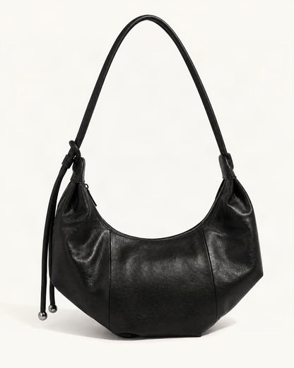 Top-Grain Cowhide Crescent Hobo Bag, Soft Crescent Crossbody — front three-quarter view on a warm white background