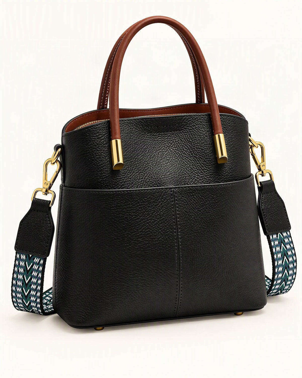Cowhide Leather Bucket Bag with Woven Strap — front three-quarter view on a warm white background