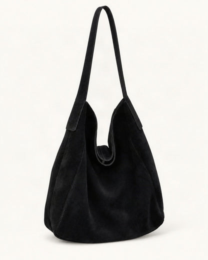 Suede Cowhide Shoulder Tote Bag — front three-quarter view on a warm white background