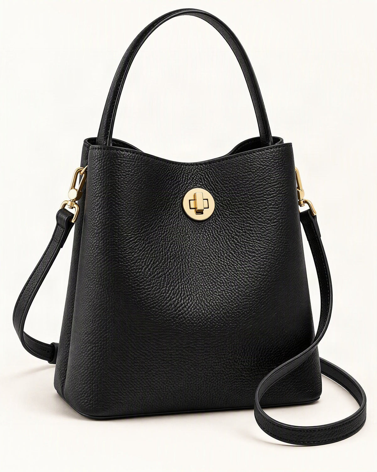 Top-Grain Cowhide Small Bucket Bag — front three-quarter view on a warm white background