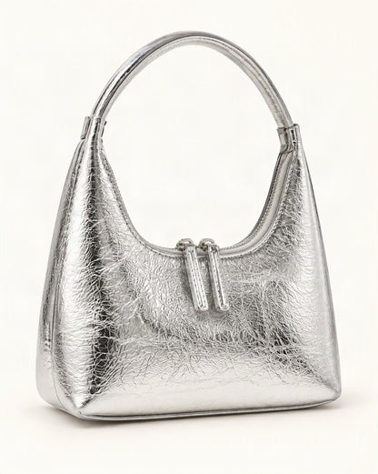 Cowhide Mini Top-Handle Hobo Bag with Double Zipper — front three-quarter view on a warm white background
