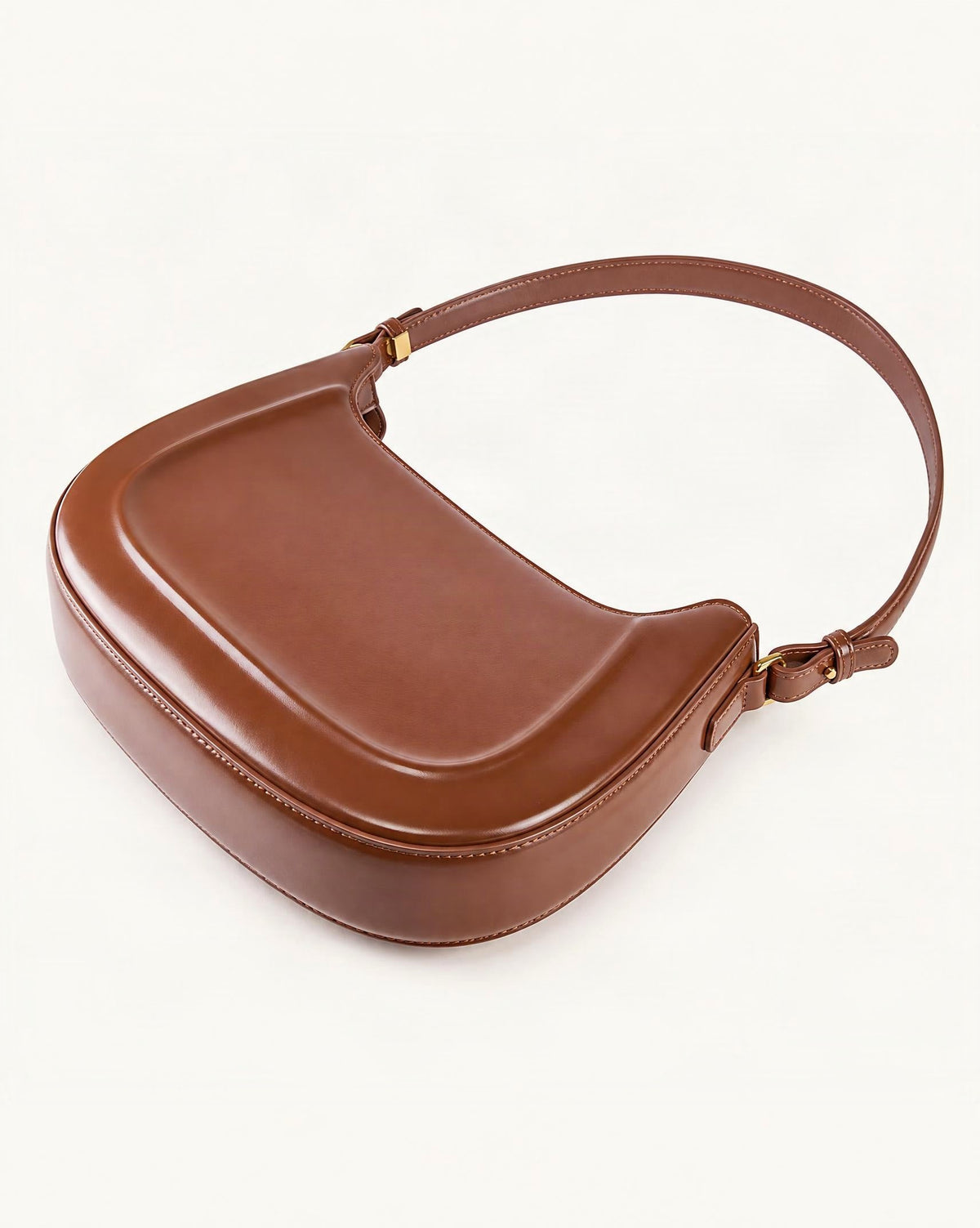Cowhide Leather Shoulder Bag, Underarm Crossbody — front three-quarter view on a warm white background