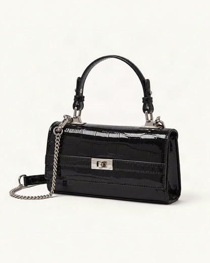 Crocodile-Embossed Cowhide Leather Envelope Crossbody Bag — front three-quarter view on a warm white background