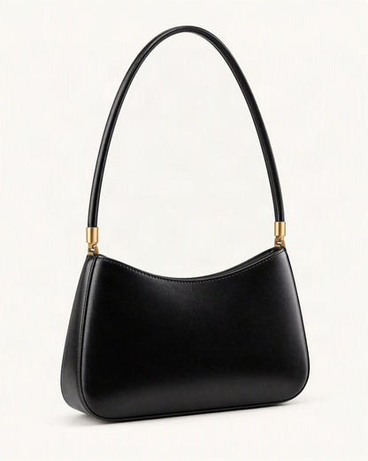 Cowhide Leather Shoulder Bag — front three-quarter view on a warm white background