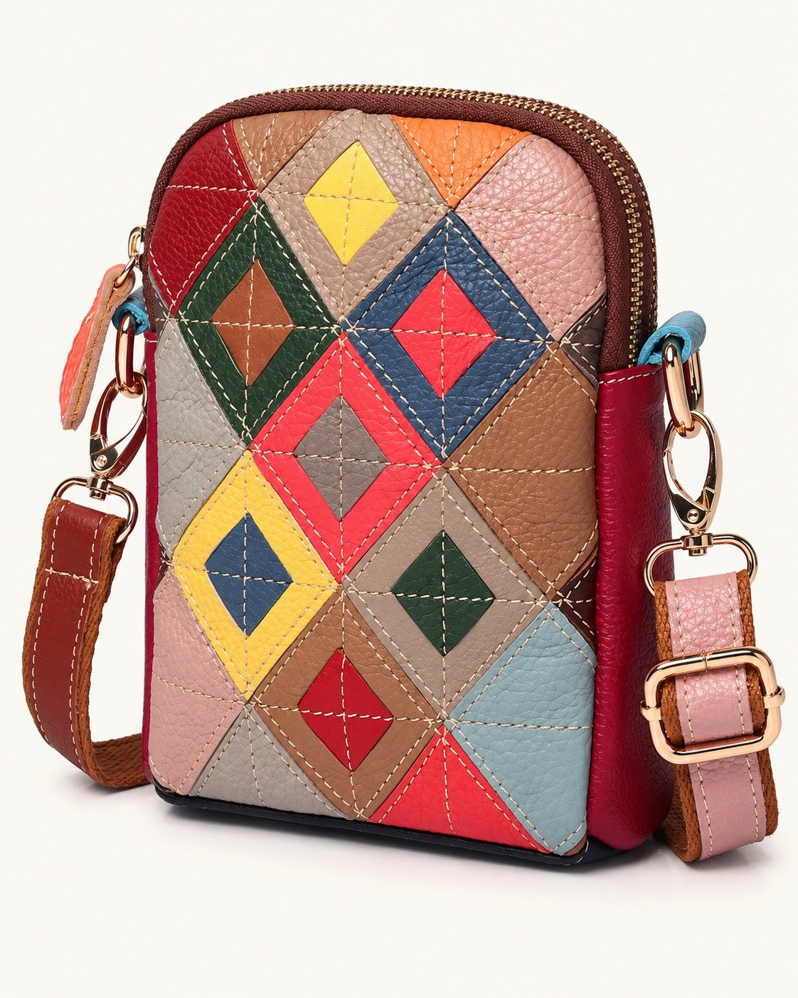 Top-Grain Cowhide Mini Shoulder Bag — front three-quarter view on a warm white background