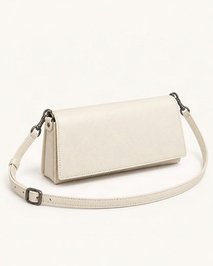Top-Grain Cowhide Flap Shoulder Bag — front three-quarter view on a warm white background
