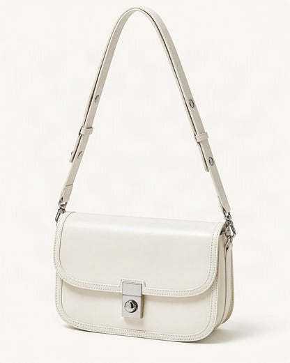 Cowhide Leather Messenger Crossbody Bag – Color Options — front three-quarter view on a warm white background