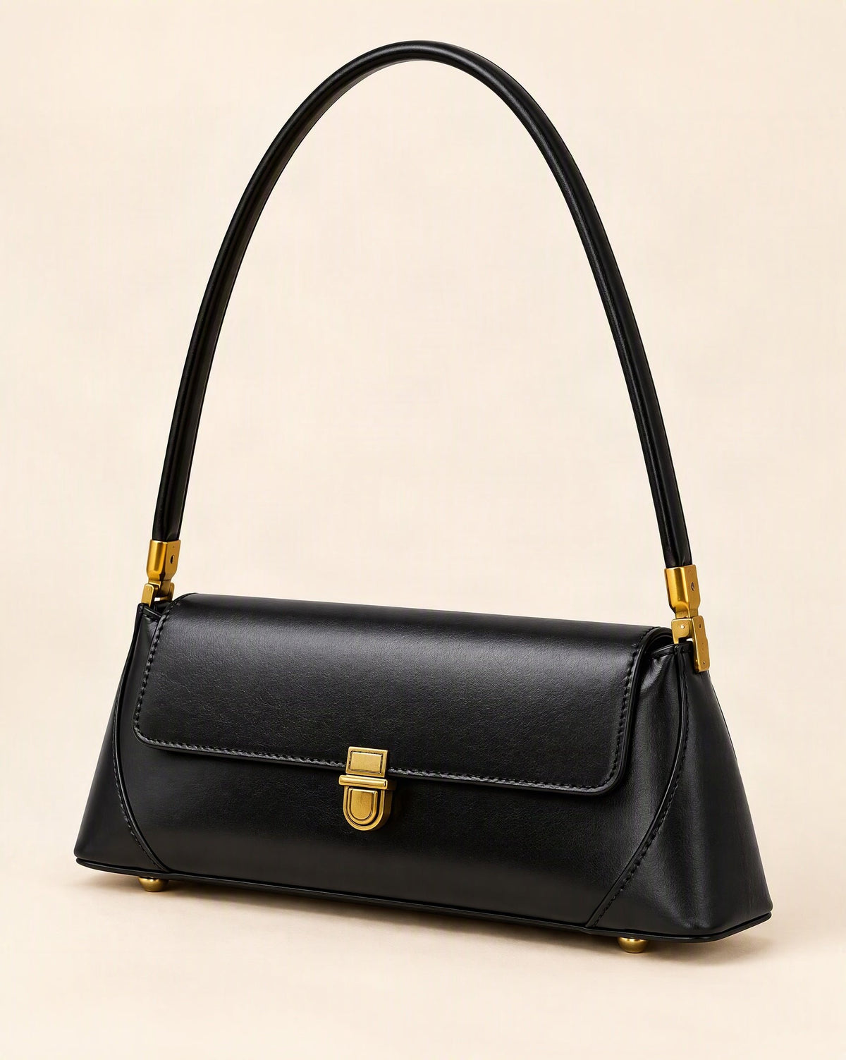 Cowhide Leather Baguette Shoulder Bag — front three-quarter view on a warm white background