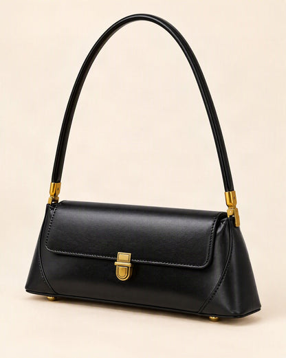 Cowhide Leather Baguette Shoulder Bag — front three-quarter view on a warm white background