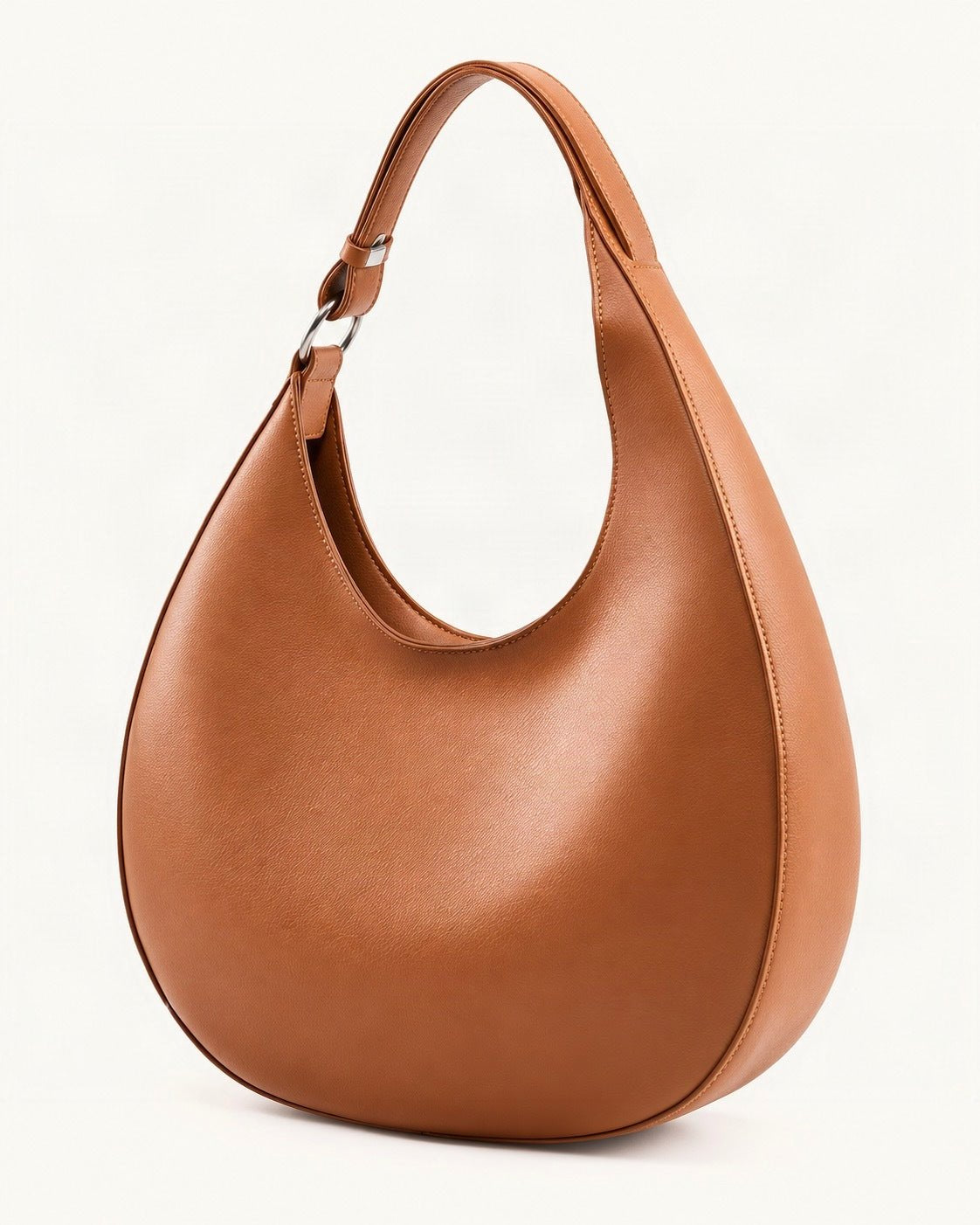 Split Leather Crescent Shoulder Bag — front three-quarter view on a warm white background
