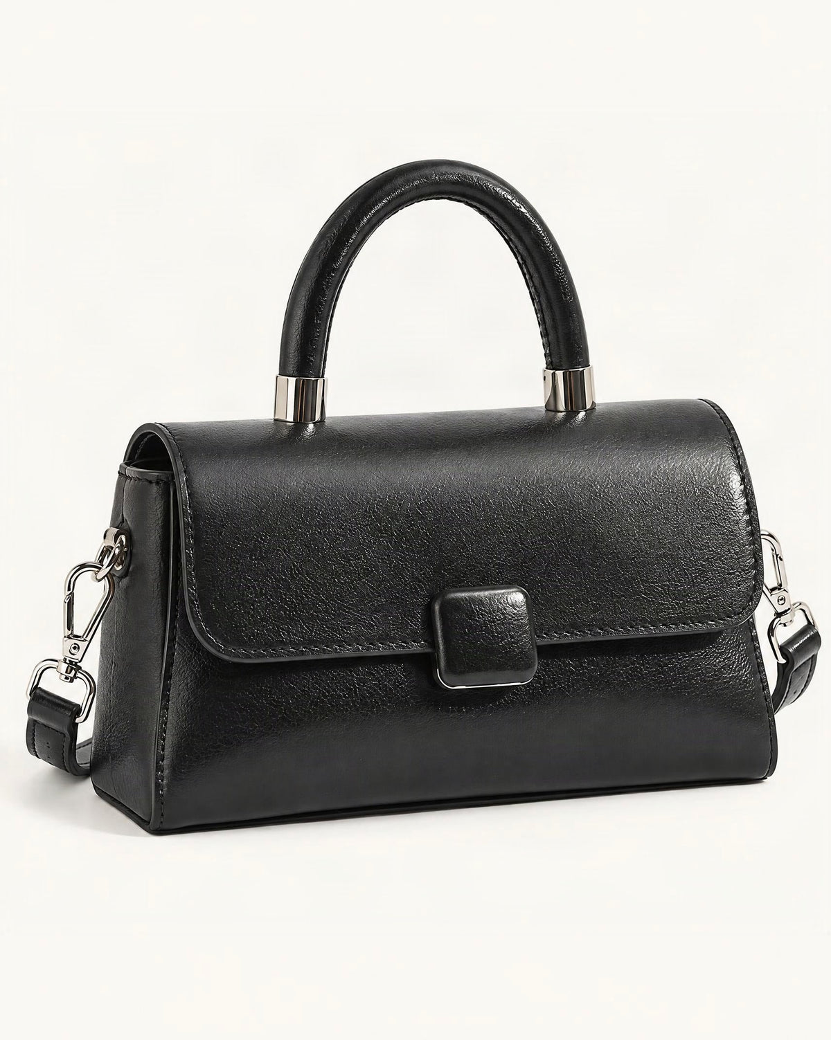 Cowhide Leather Small Top-Handle Crossbody Bag — front three-quarter view on a warm white background
