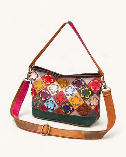 Top-Grain Cowhide Small Crossbody Bag — front three-quarter view on a warm white background