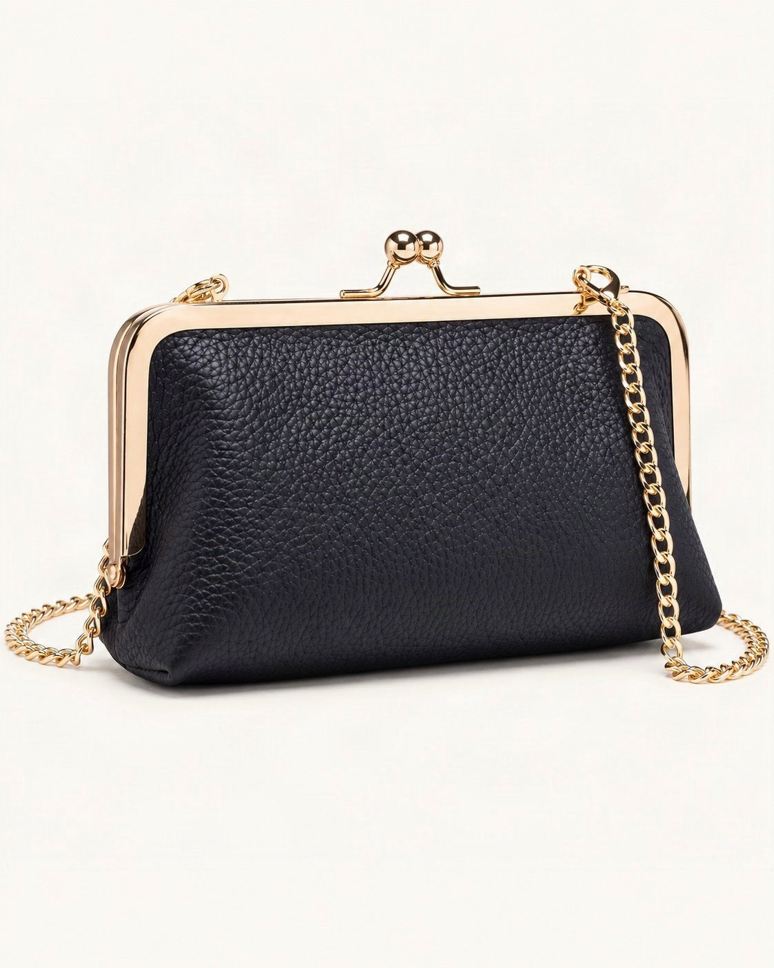 Top-Grain Cowhide Frame Crossbody Bag — front three-quarter view on a warm white background