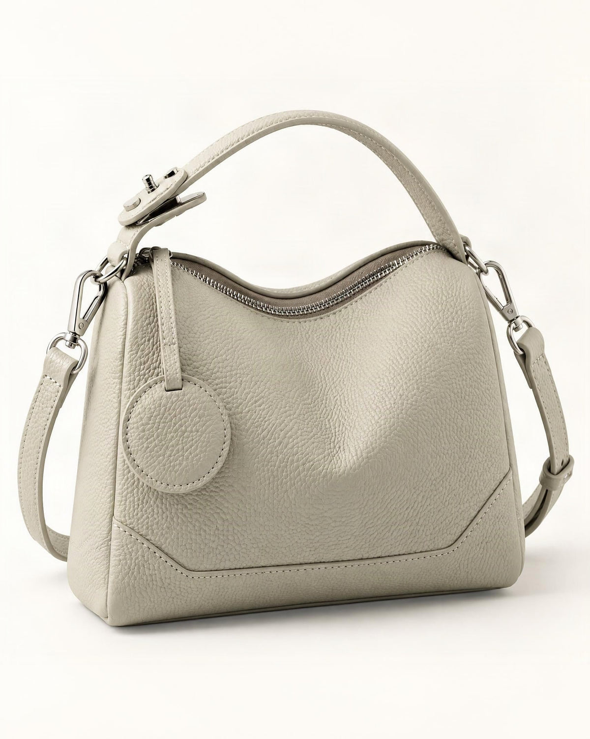 Cowhide Mini Boston Bag Shoulder — front three-quarter view on a warm white background