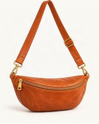 Top-Grain Cowhide Leather Crossbody Sling Bag — front three-quarter view on a warm white background