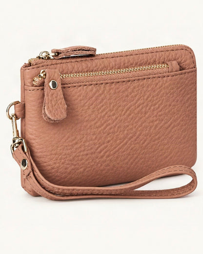 Genuine Leather Mini Clutch Wallet — front three-quarter view on a warm white background