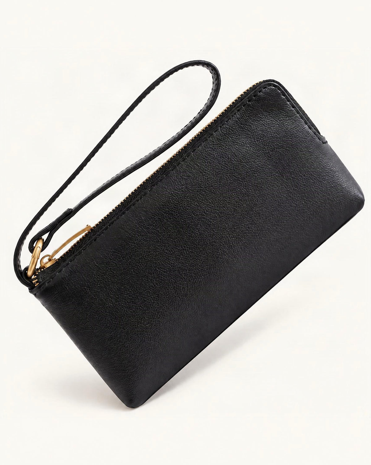 Cowhide Leather Long Wallet with Wrist Strap — front three-quarter view on a warm white background