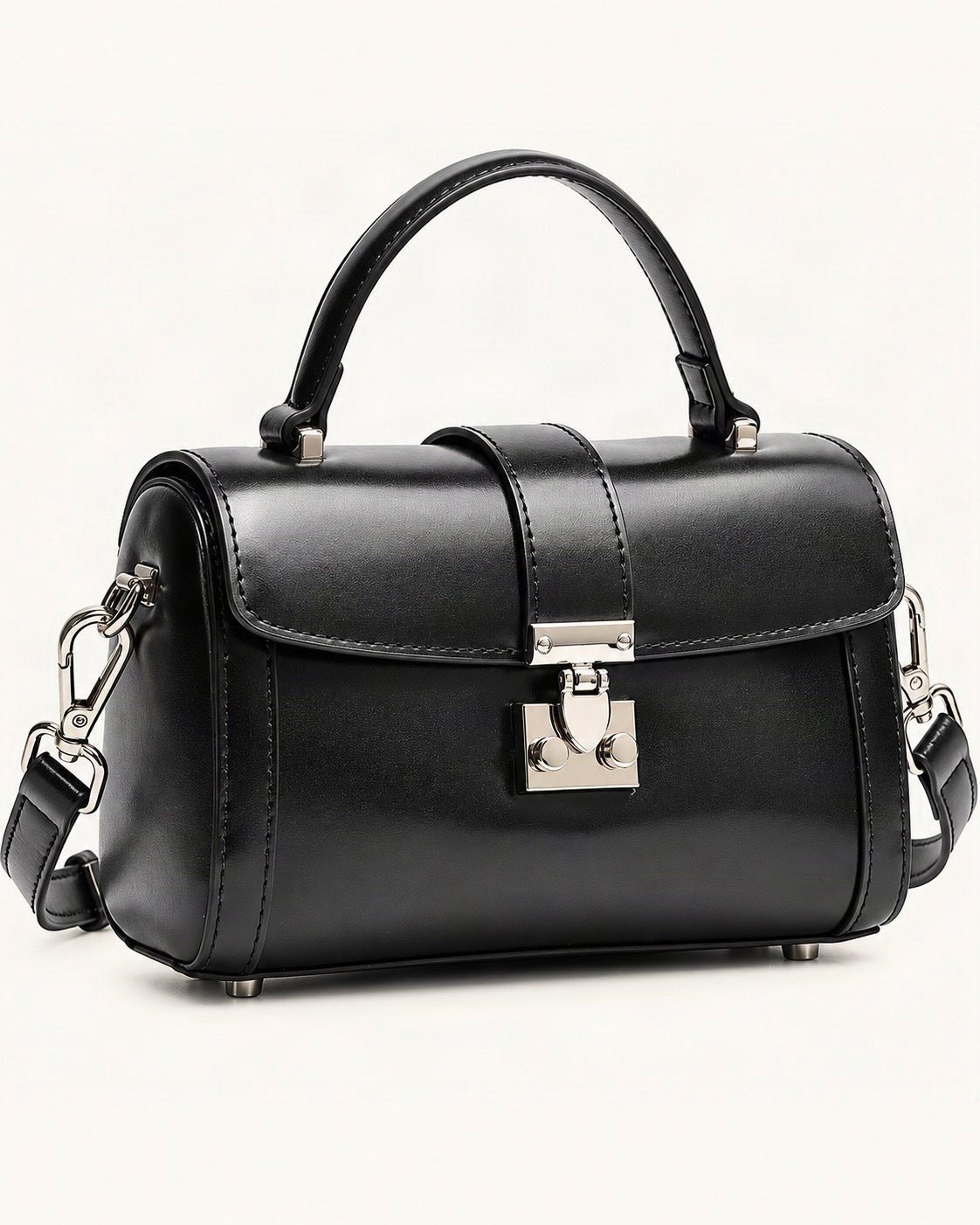 Cowhide Leather Mini Box Crossbody Bag with Lock Clasp — front three-quarter view on a warm white background