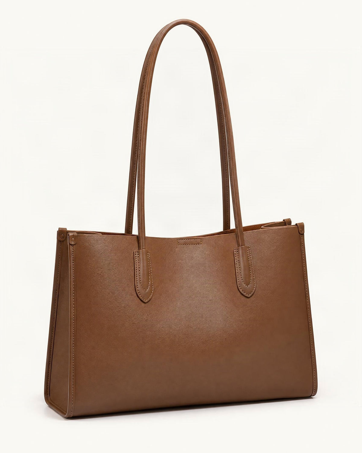 Soft Cowhide Leather Tote Bag, Spacious Shoulder Handbag — front three-quarter view on a warm white background