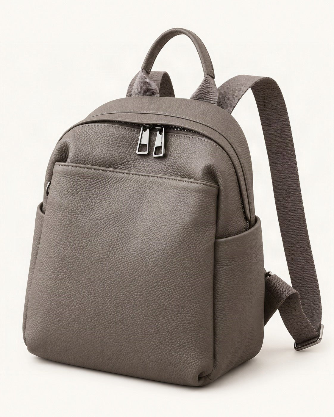 Top-Grain Cowhide Small Backpack – Color Options — front three-quarter view on a warm white background