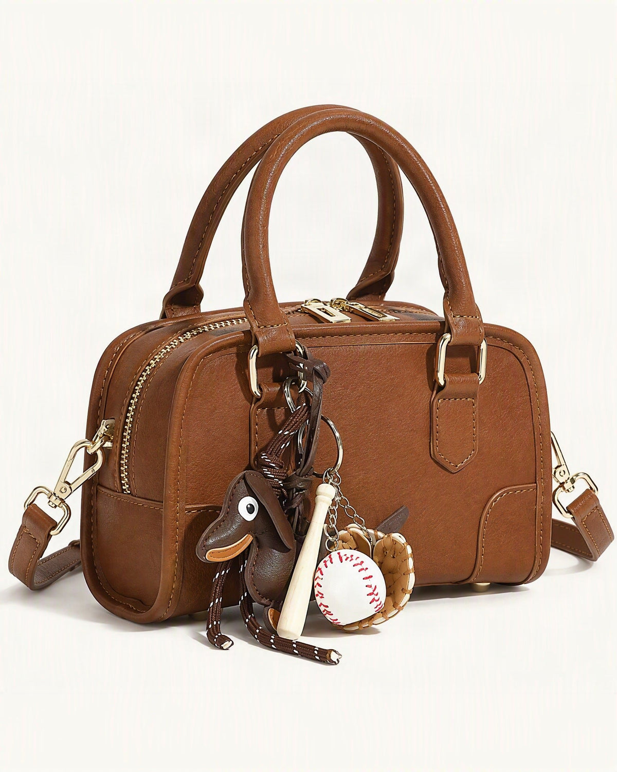 Split Leather Small Bowling Bag — front three-quarter view on a warm white background