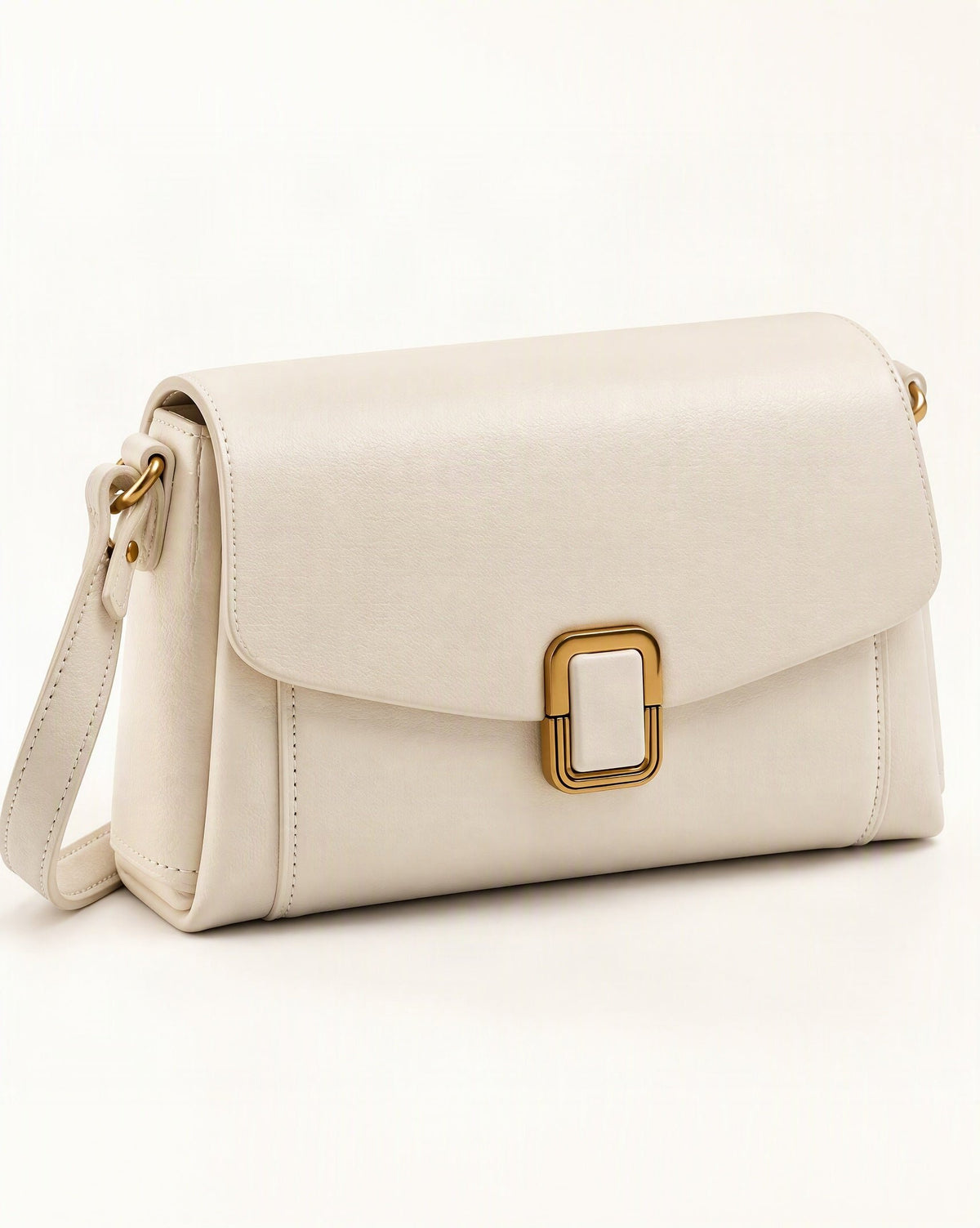 Cowhide Leather Small Crossbody Bag with Adjustable Strap — front three-quarter view on a warm white background