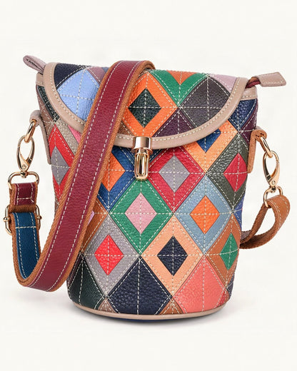 Top-Grain Cowhide Patchwork Bucket Crossbody Bag — front three-quarter view on a warm white background