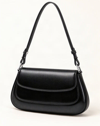 Genuine Cowhide Leather Baguette Shoulder Bag — front three-quarter view on a warm white background