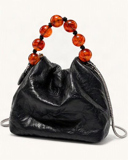 Crinkle Cowhide Mini Crossbody Bag with Beaded Handle — front three-quarter view on a warm white background