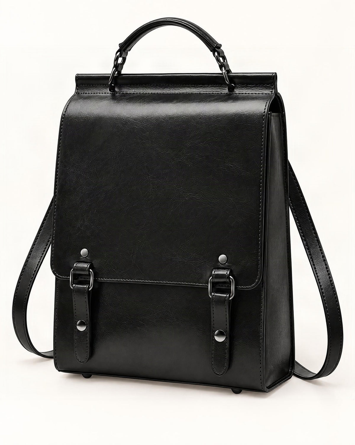 Cowhide Leather Small Backpack with Buckle Flap — front three-quarter view on a warm white background