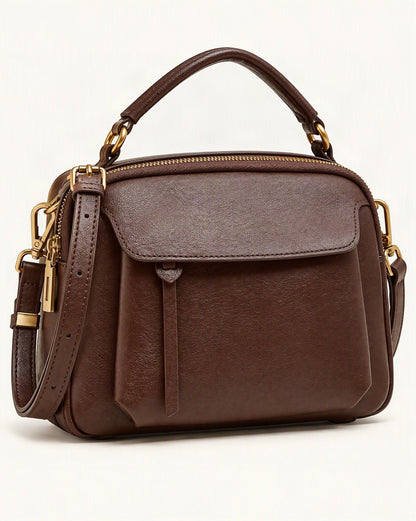 Top-Grain Cowhide Boston Crossbody Bag — front three-quarter view on a warm white background