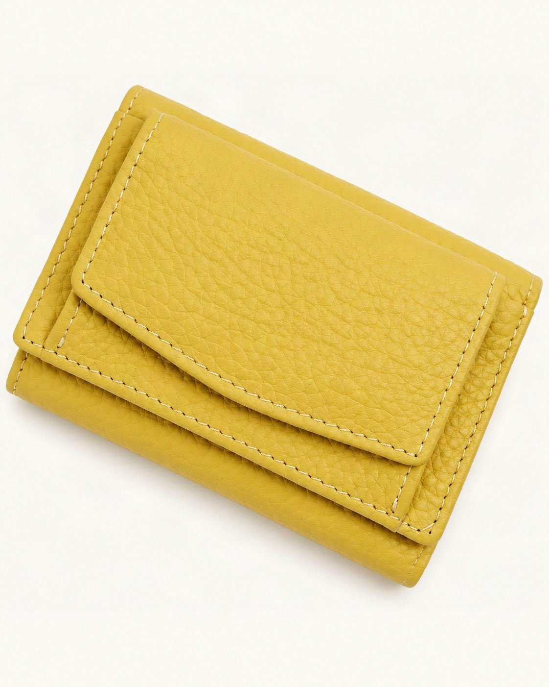 Cowhide Tri-Fold RFID-Blocking Wallet — front three-quarter view on a warm white background