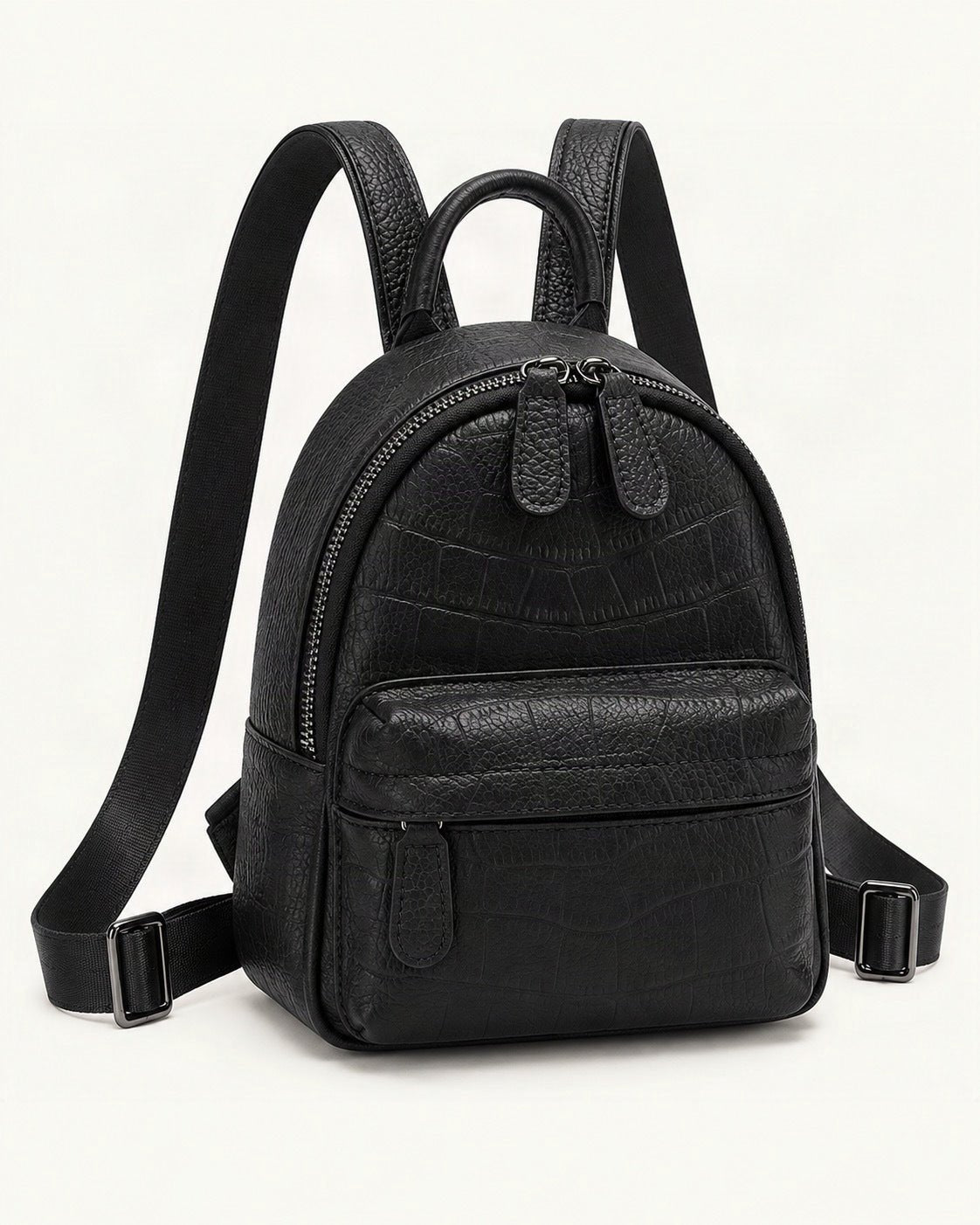 Split Leather Mini Backpack — front three-quarter view on a warm white background