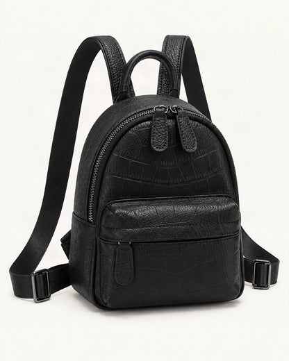 Split Leather Mini Backpack — front three-quarter view on a warm white background