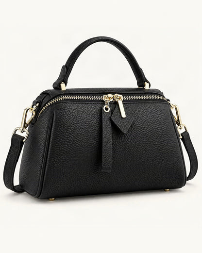 Top-Grain Cowhide Small Boston Bag — front three-quarter view on a warm white background