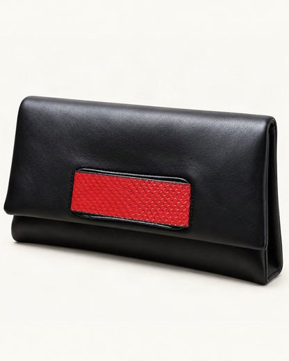 Cowhide Envelope Clutch Bag — front three-quarter view on a warm white background