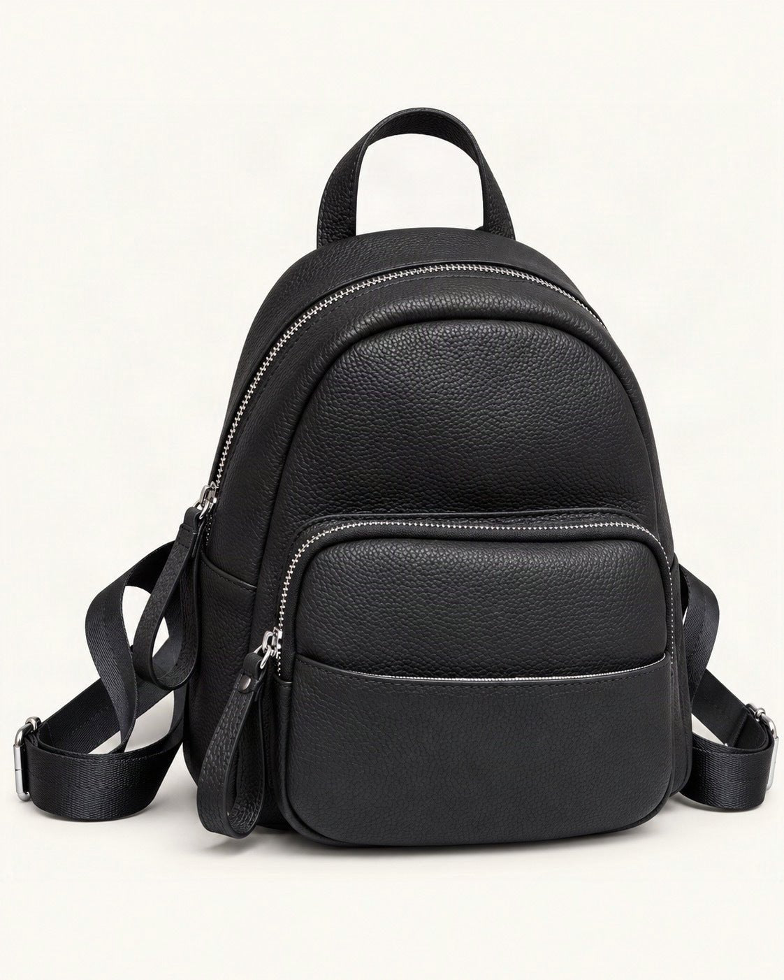 Leather Mini Backpack — front three-quarter view on a warm white background