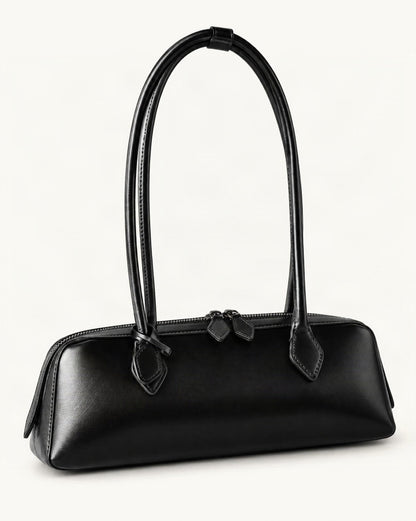 Cowhide Leather Small Plus Shoulder Baguette Bag — front three-quarter view on a warm white background