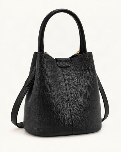 Top-Grain Cowhide Mini Bucket Bag — front three-quarter view on a warm white background